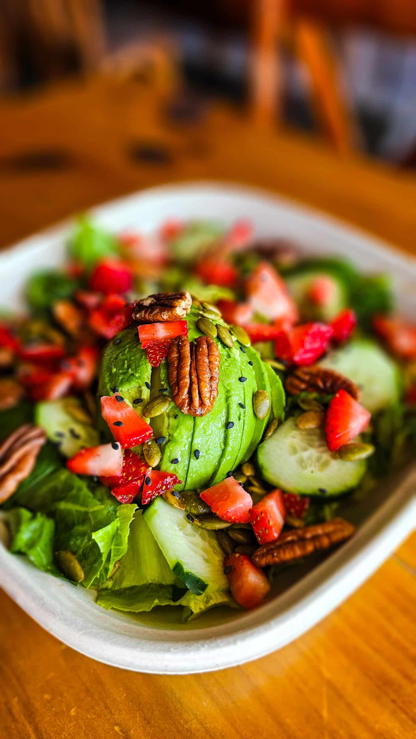 Healthy homestyle pollo in salsa with green spaghetti and mashed potatoes on a plate in Brownsville Texas.
