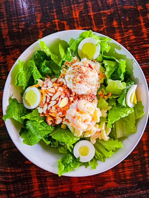 Colorful homestyle mixed salad on a dinner plate in Brownsville Texas restaurant
